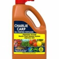 A 2.2-liter container of Charlie Carp All Purpose Liquid Fertilizer Spray Pack with a red cap, designed to stimulate growth, boost plant immune systems, and improve soil.