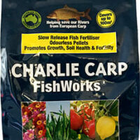 A 5kg bag of Charlie Carp FishWorks Slow Release Fertiliser Pellets, featuring images of flowers and plants, and text promoting benefits such as odorless Fertiliser Pellets, slow release, soil health, and fertility.