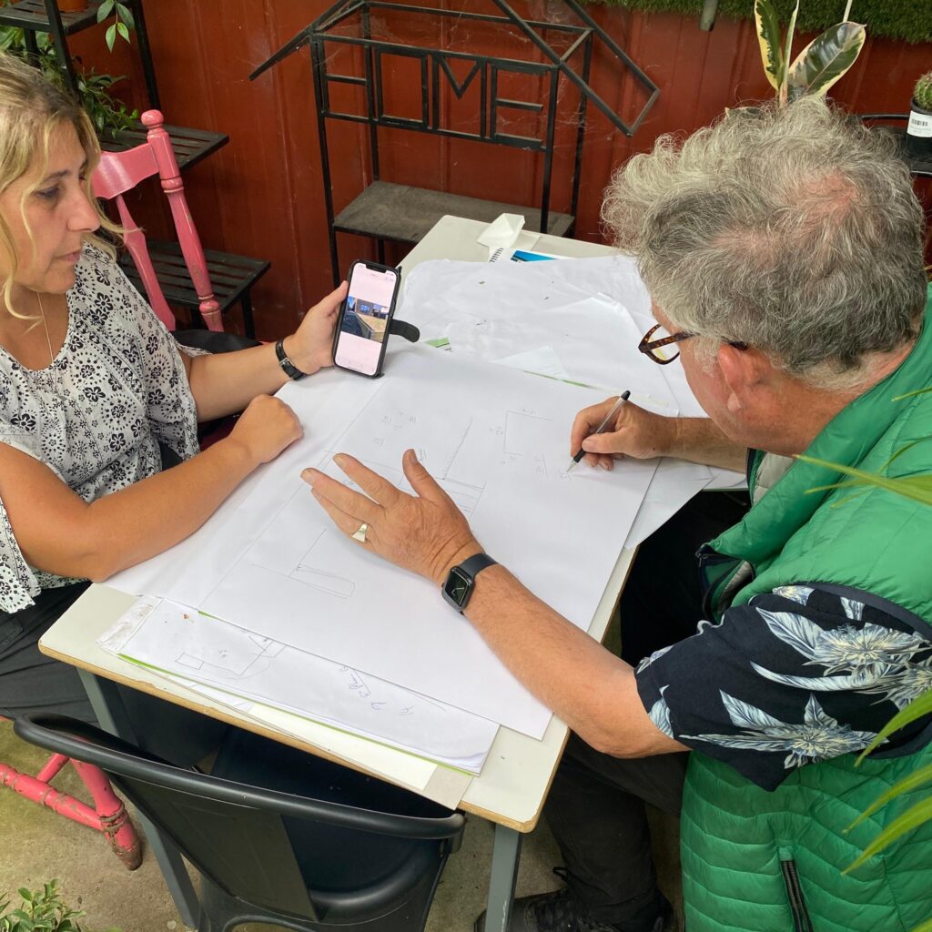 Chris helps a customer design their dream garden