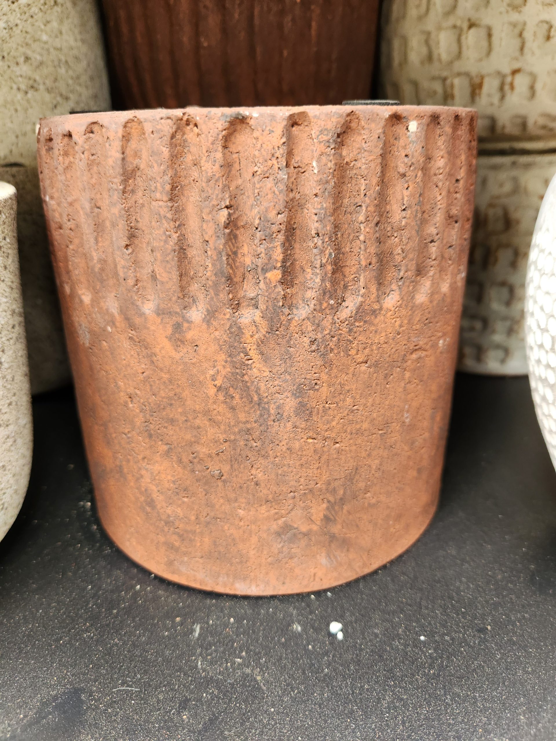 Dart Cylinder Earth Pot 15x15cm pots on a table next to each other.