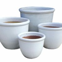 Four white ceramic pots decorative for gardens and plants