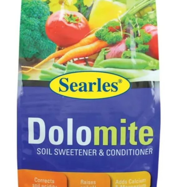 Package of Searles '5 in 1 Organic Fertiliser' 30L, displaying colorful vegetables and text about its benefits like correcting soil acidity, adding nutrients, and enhancing pyrethrum effectiveness.