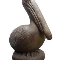 The Iridami Small Pelican Rustiq sculpture (30x64x54cm) in white stone exudes tranquility with its large beak and round body, echoing the elegance of Iridami reliefs and capturing Dewi Sri's serene essence.