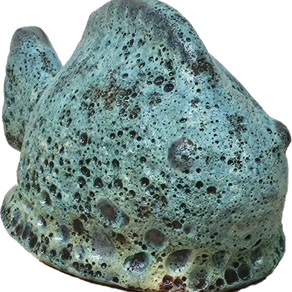 The Portica Dog Grey Decor L 19x14x23cm features a textured rock design with a weathered green-blue surface and small holes, echoing the rugged charm of nature.