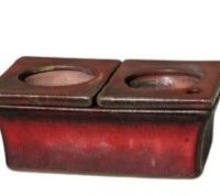 A rectangular red ceramic African Violet Dual Self-Watering Planter (18x12x7cm) with two side-by-side circular openings on top, shown against a white background.