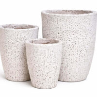 Three white, textured cylindrical planters of varying heights are arranged closely together on a white background.